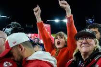 Taylor Swift, left, and Donna Kelce watch the Kansas City Chiefs receive the Lamar Hunt trophey ...