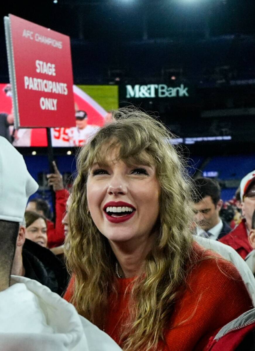 Taylor Swift watches the Kansas City Chiefs receive the Lamar Hunt trophey after an AFC Champio ...