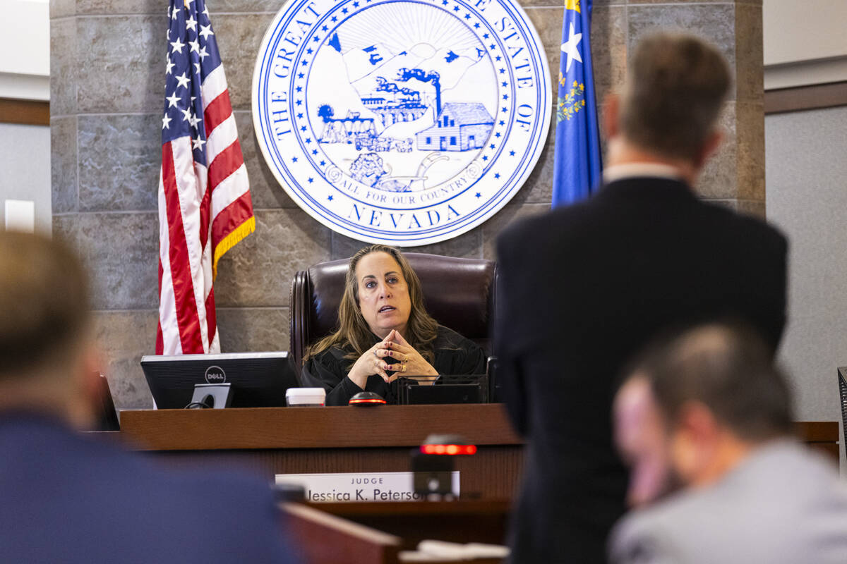 District Judge Jessica Peterson presides over a court hearing at the Regional Justice Center on ...