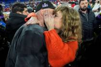 Taylor Swift speaks with Kansas City Chiefs tight end Travis Kelce after an AFC Championship NF ...