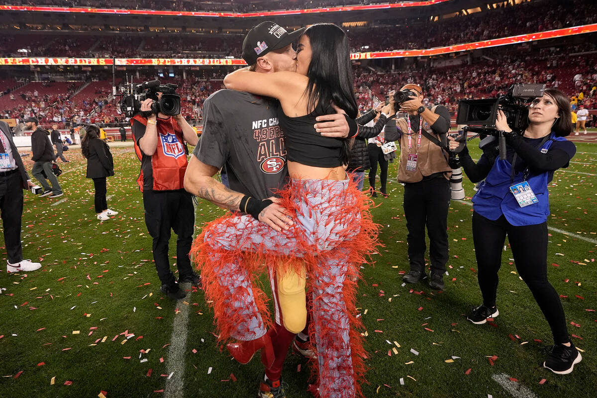 San Francisco 49ers tight end George Kittle, middle left, celebrates with his wife, Claire, aft ...