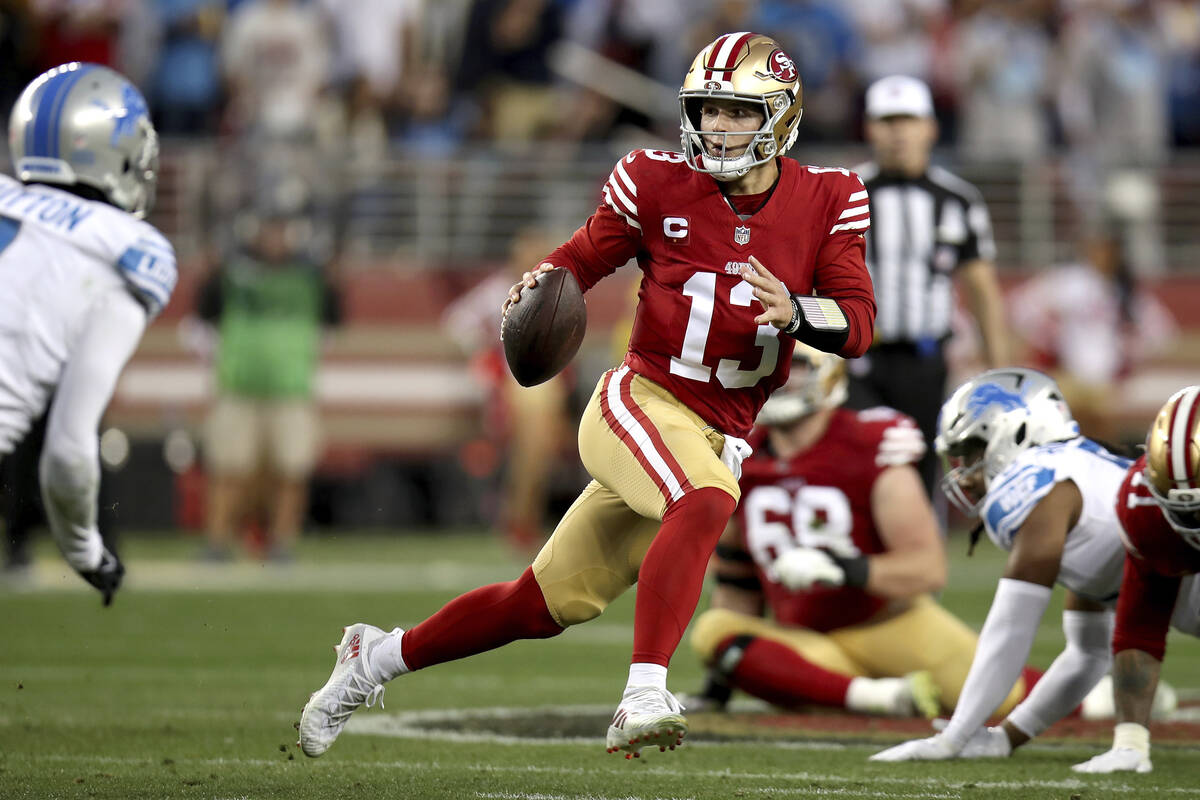 San Francisco 49ers quarterback Brock Purdy (13) scrambles during the NFC Championship NFL foot ...