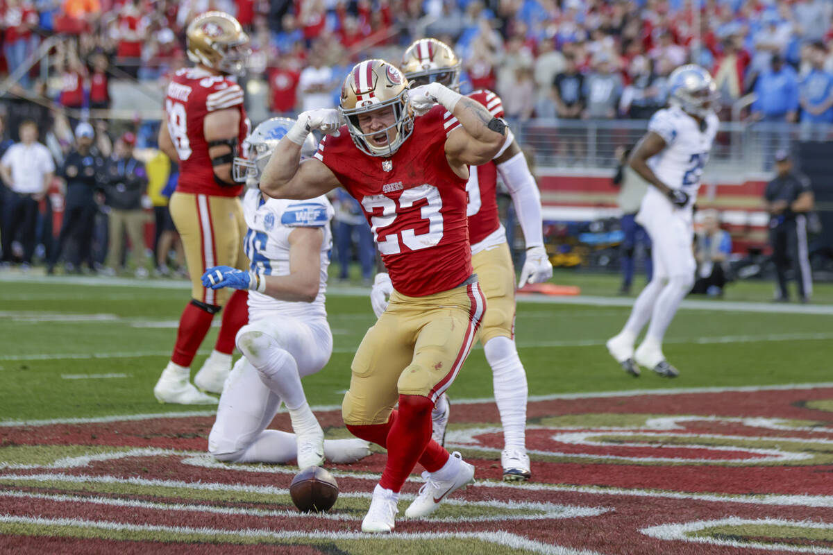 San Francisco 49ers' running back Christian McCaffrey (23) reacts after scoring a touchdown aga ...