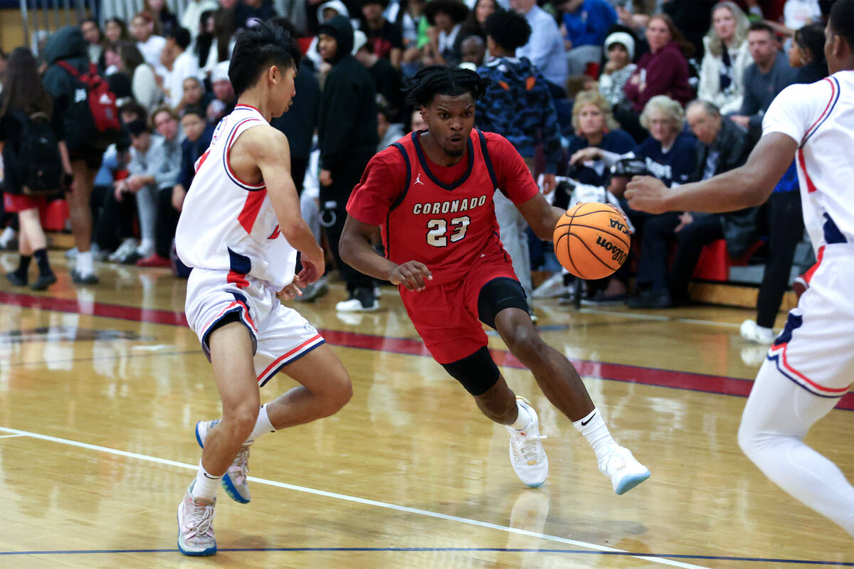 Coronado guard Josiah Cunningham (23) drives toward the hoop against Liberty guard Braydon Cres ...