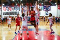 Coronado guard Josiah Cunningham (23) shoots against Liberty forward Andre Porter (5) and forwa ...