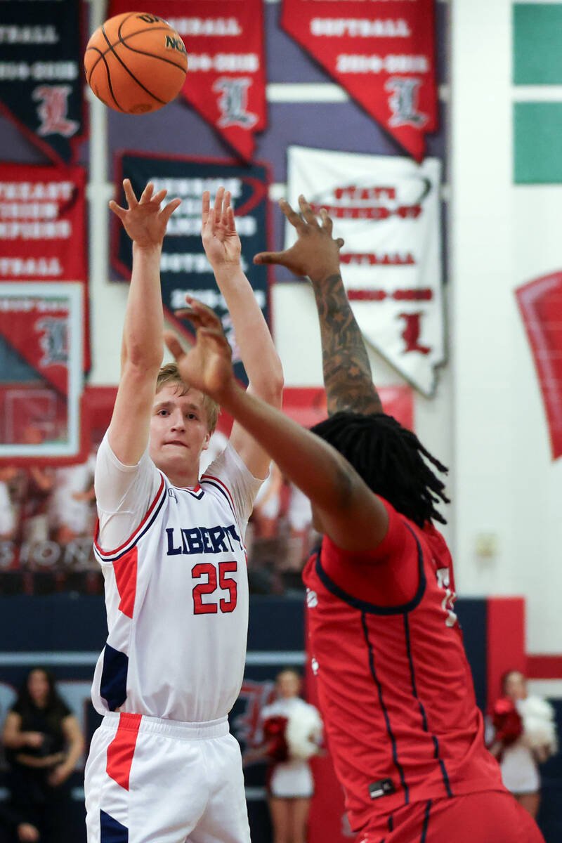 Liberty forward Tyler Bright (25) shoots against Coronado center Tee Bartlett (13) during the f ...