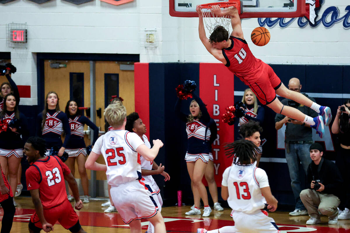 Coronado forward JJ Buchanan (10) dunks on Liberty during the second half of a high school bask ...