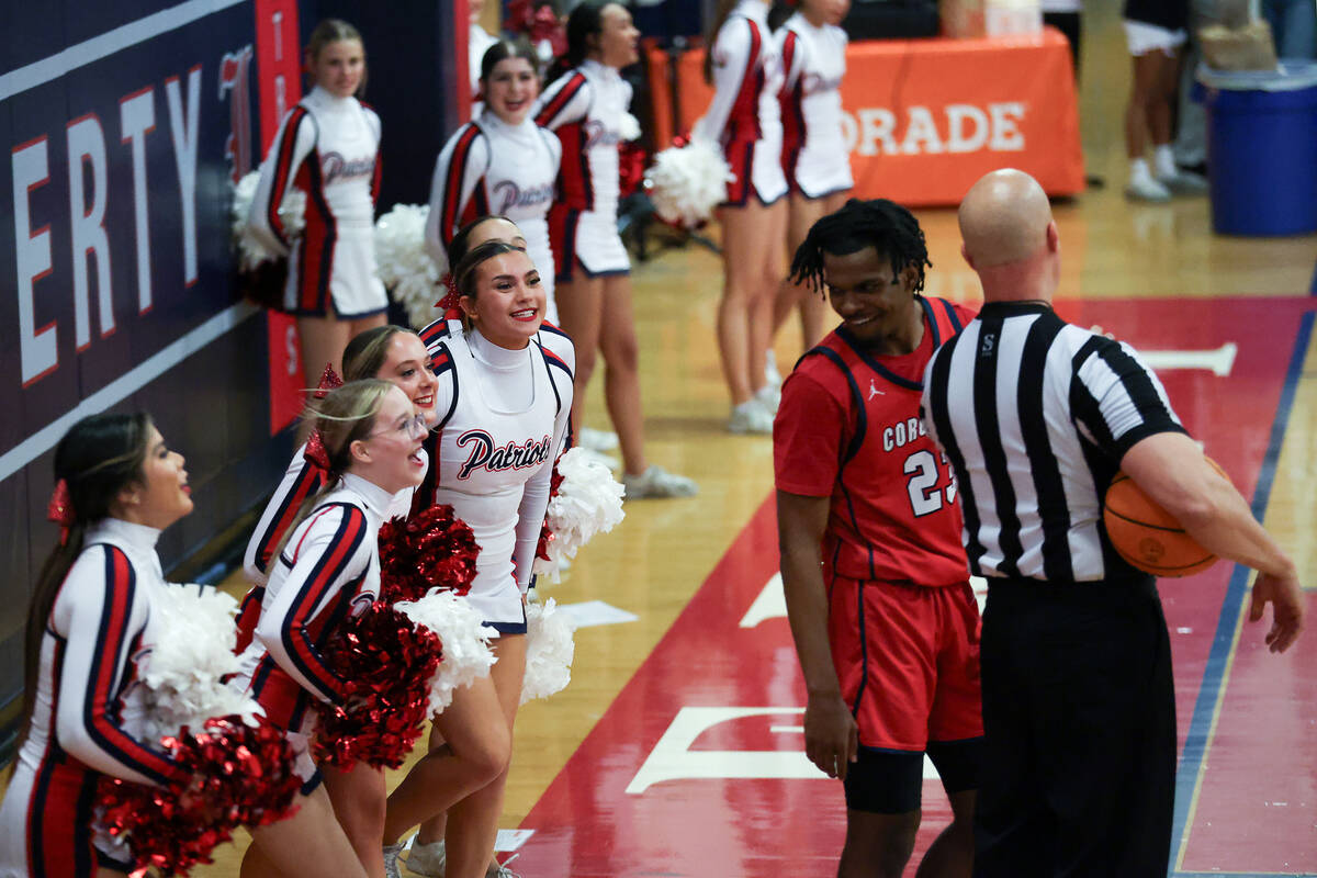 Liberty cheerleaders taunt Coronado guard Josiah Cunningham (23) as their team is trailing duri ...