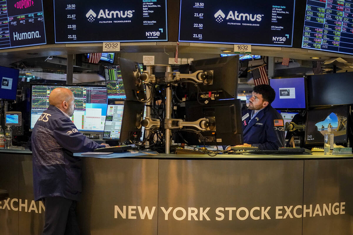 FILE -Traders work at their stations at the New York Stock Exchange, Friday, May 26, 2023, in N ...