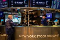 Traders work at their stations at the New York Stock Exchange, Friday, May 26, 2023, in New Yor ...