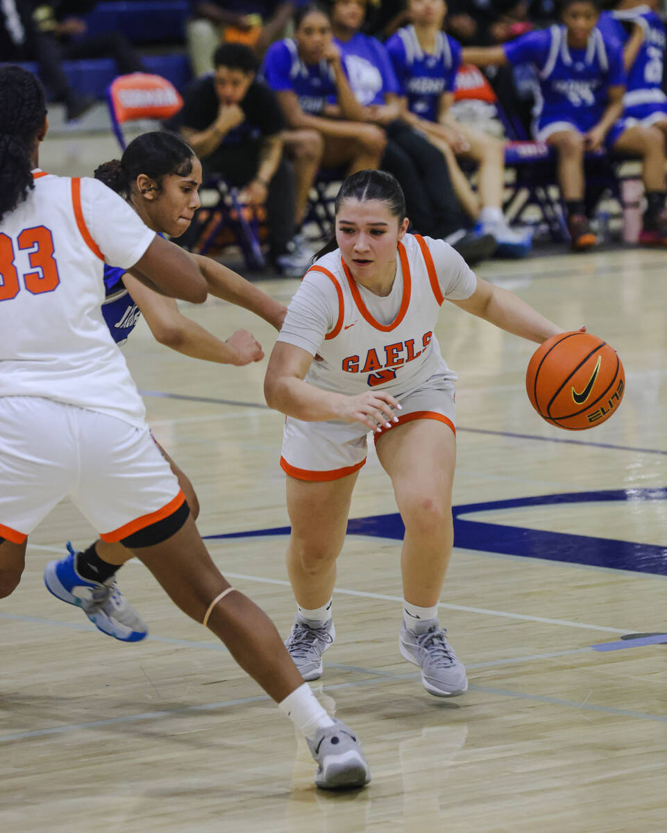 Bishop Gorman’s Sydney Chestnut (5) dribbles past Desert Pines players during a game at ...