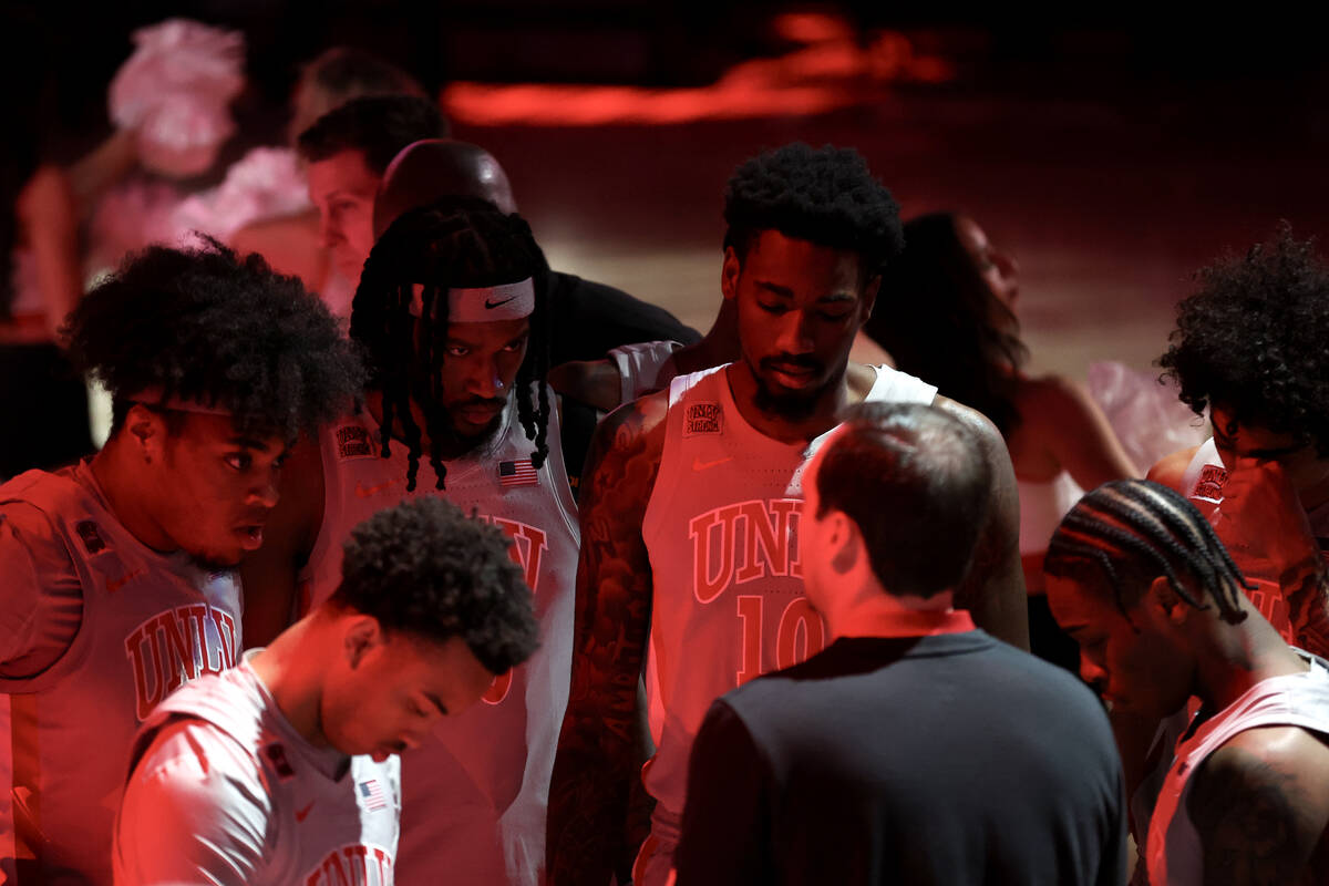 The UNLV Rebels huddle before an NCAA college basketball game against the Fresno State Bulldogs ...