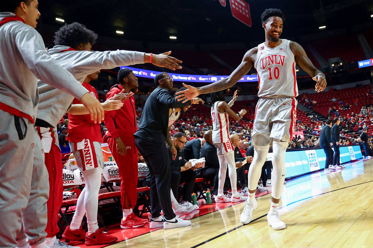 UNLV Rebels forward Kalib Boone (10) slaps hands with the bench during the second half of an NC ...