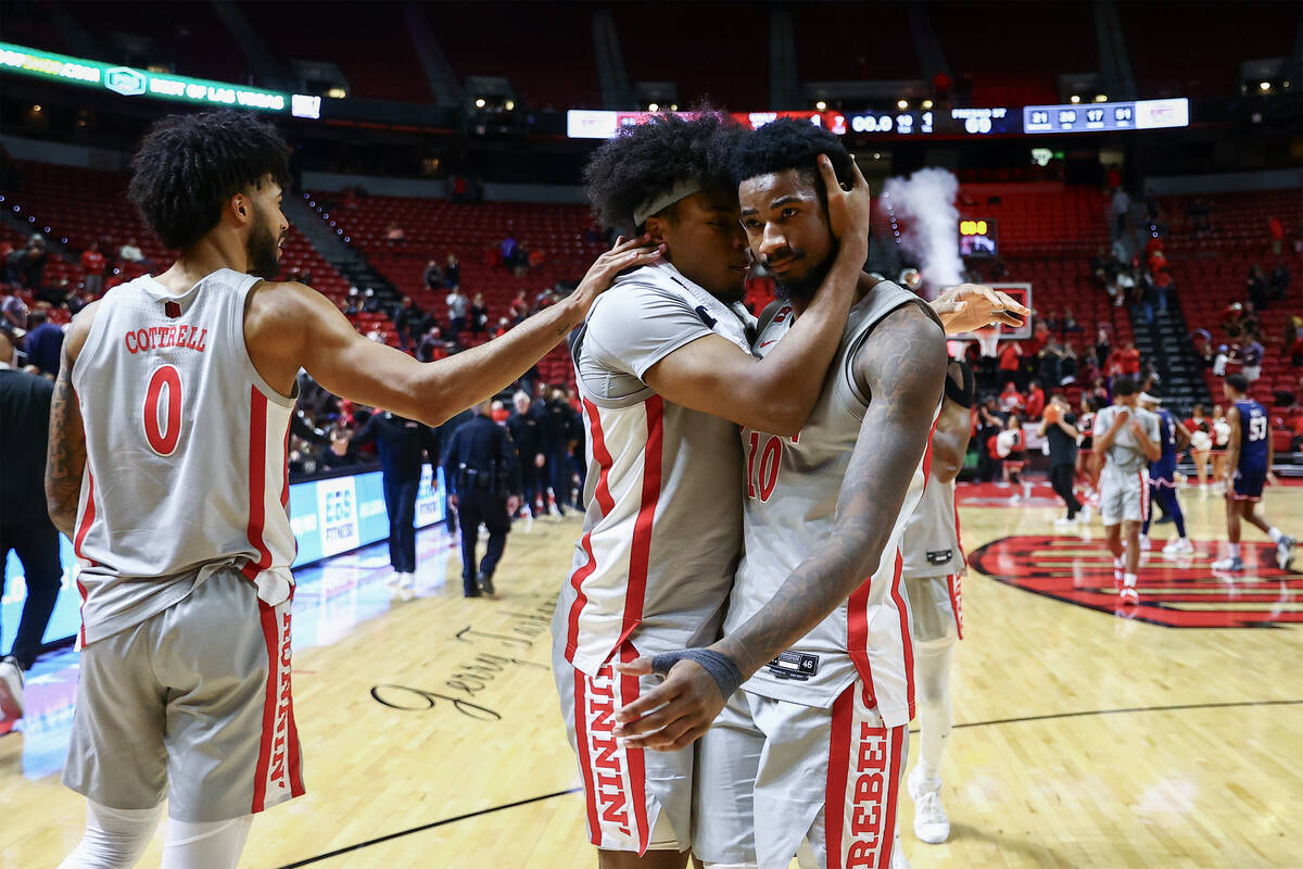 UNLV Rebels forward Rob Whaley Jr., center left, receives a pat from forward Isaiah Cottrell (0 ...
