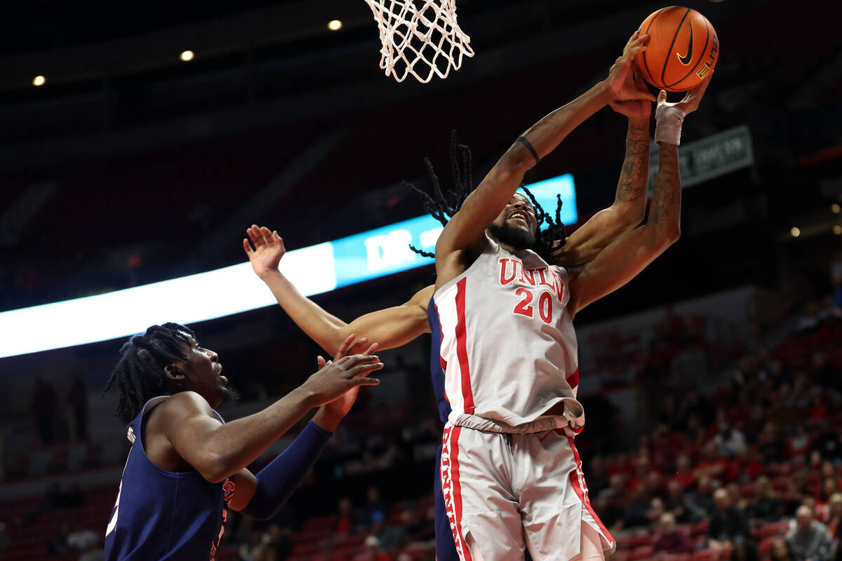 UNLV Rebels forward Keylan Boone (20) jumps for a rebound against the Fresno State Bulldogs dur ...