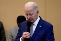 President Biden bows his head in a moment of silence for the three American troops killed Sunda ...