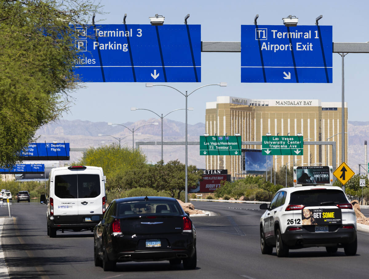 A sign directing traffic to Terminal 3 is posted at Harry Reid International Airport on Friday, ...