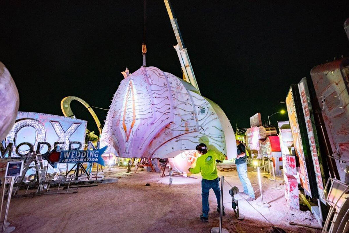 A large portion of a 1970s Flamingo Hotel & Casino sign is moved by crane on Tuesday, Jan. 30, ...