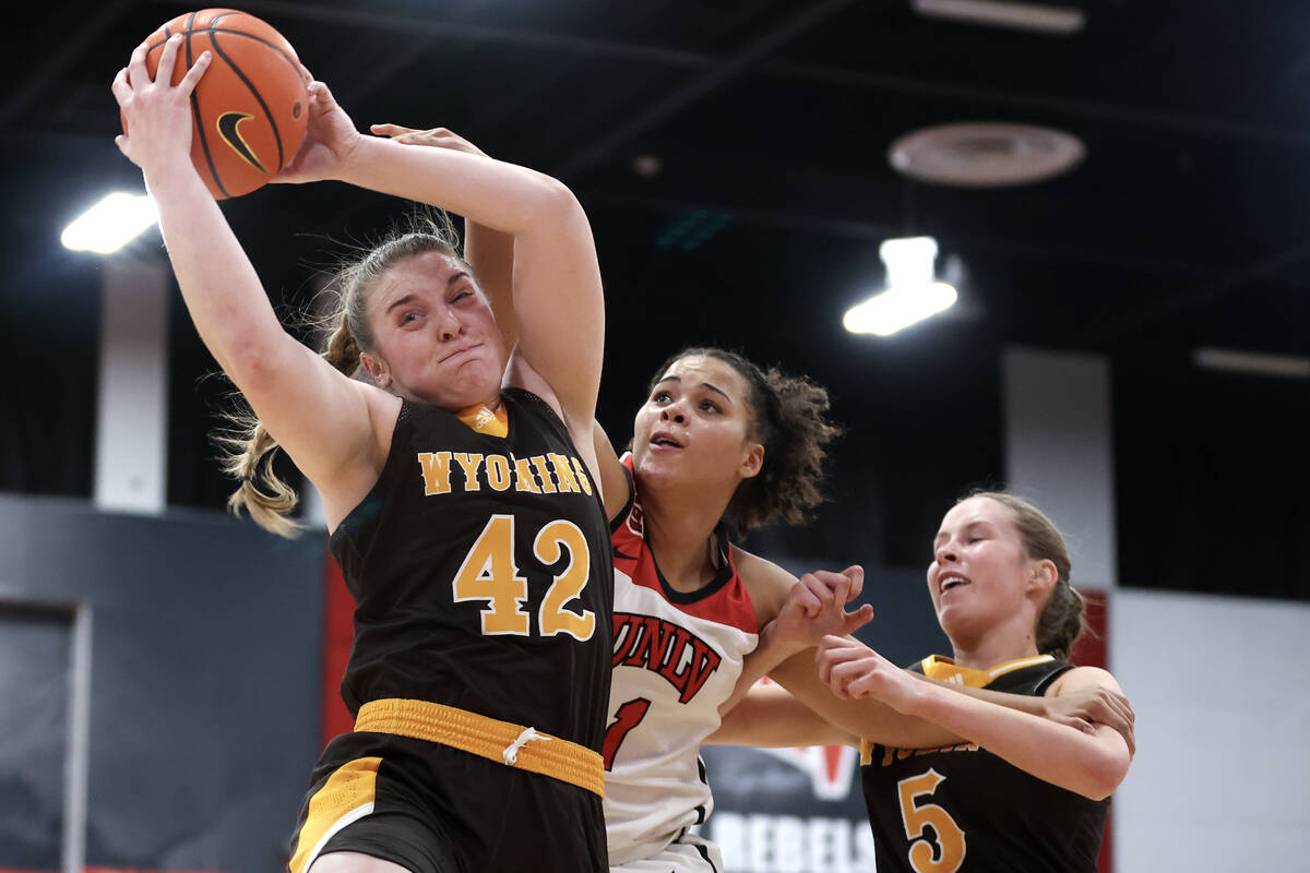 Wyoming Cowgirls guard McKinley Dickerson (42) stages a rebound over UNLV Lady Rebels forward N ...