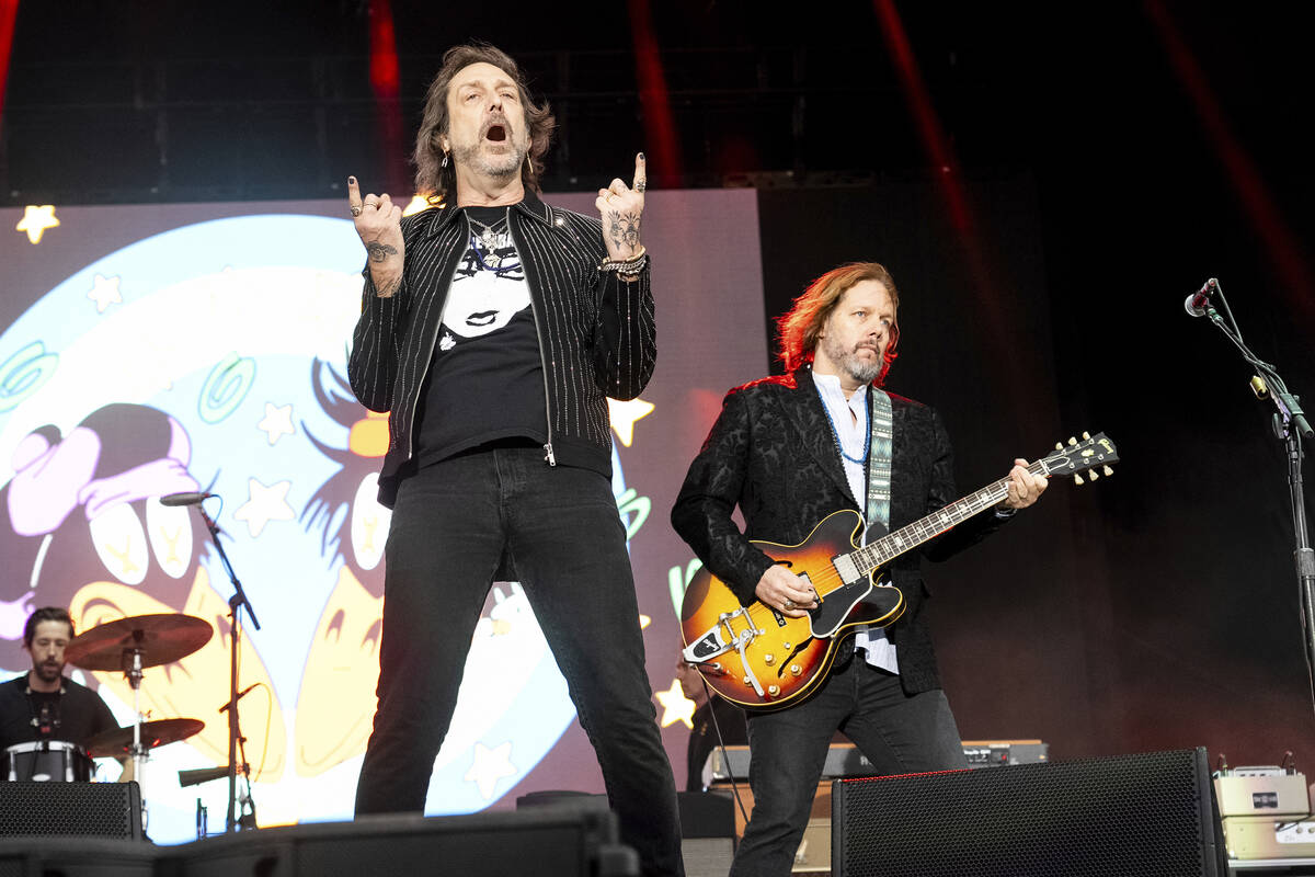 Chris Robinson, left, and Rich Robinson of The Black Crowes perform during the Bourbon and Beyo ...