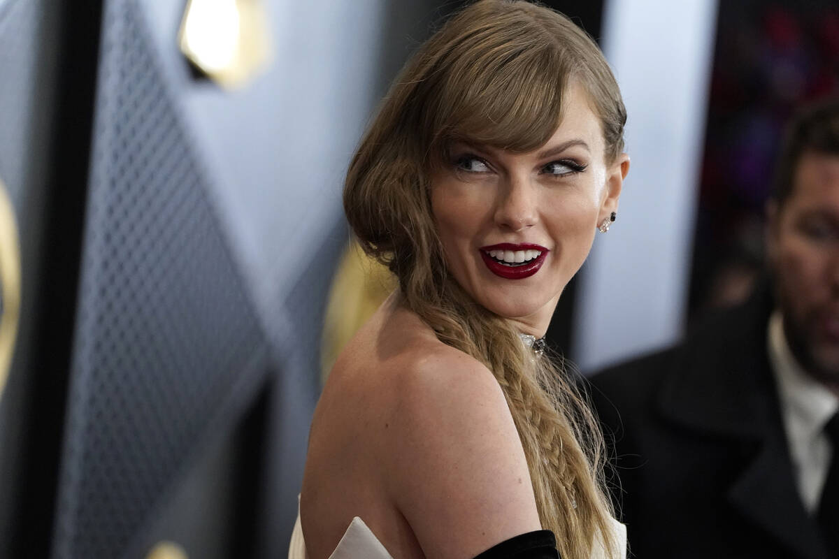 Taylor Swift arrives at the 66th annual Grammy Awards on Sunday, Feb. 4, 2024, in Los Angeles. ...