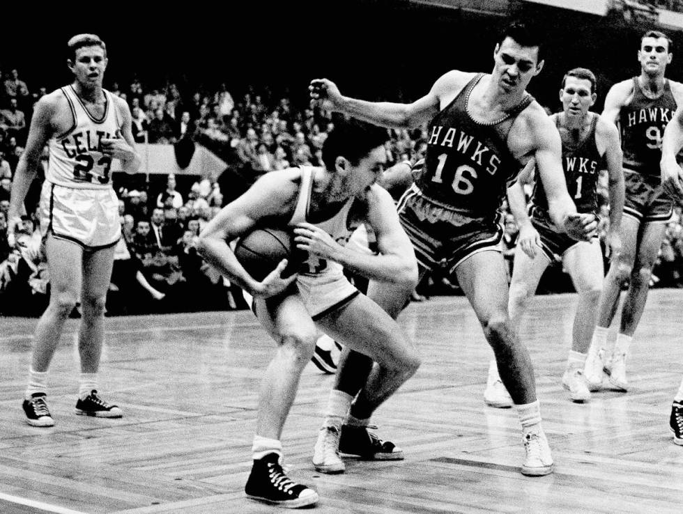 FILE - In this March 30, 1958, file photo, Boston Celtics' Bill Sharman holds the ball as St. ...