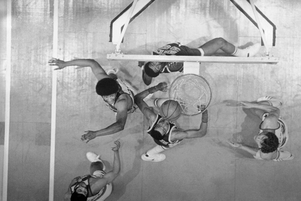 Washington Bullet Wes Unseld , right, sets for a rebound from Paul Silas; 35, shot at the baske ...