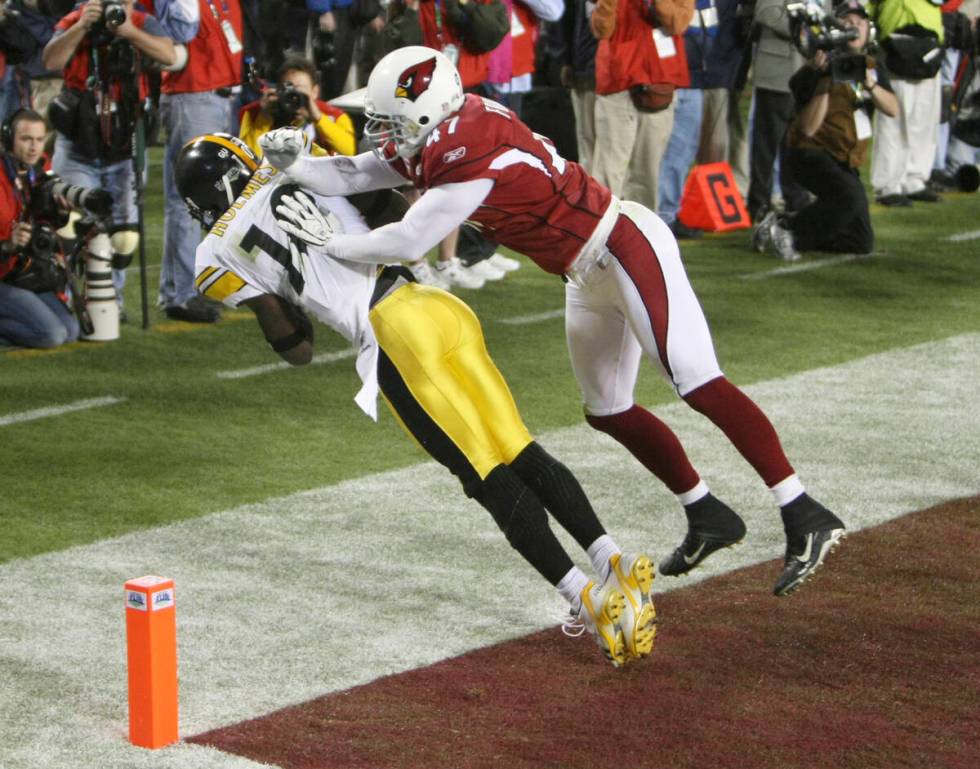 FILE - Pittsburgh Steelers wide receiver Santonio Holmes (10) catches a touchdown pass as Arizo ...