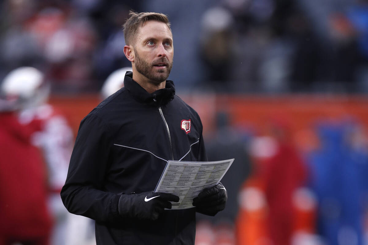 Arizona Cardinals head coach Kliff Kingsbury walks the field before an NFL football game agains ...