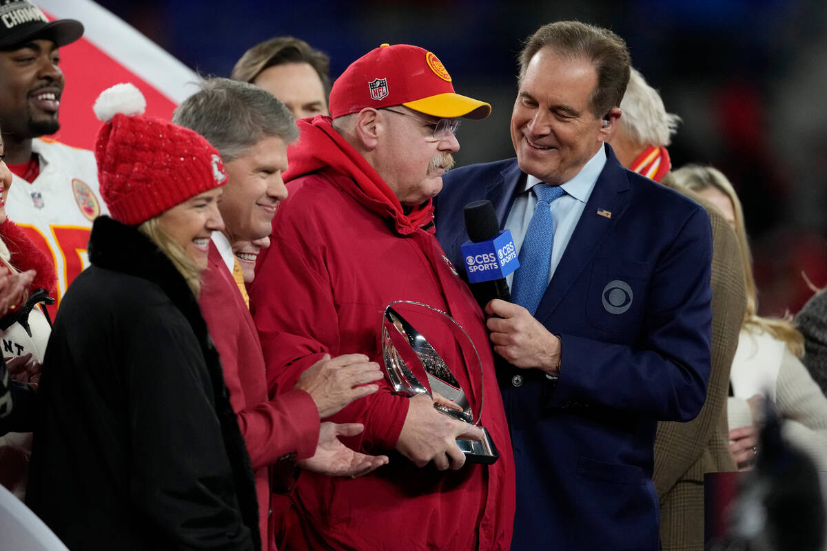 Kansas City Chiefs head coach Andy Reid holds the Lamar Hunt trophy after an AFC Championship N ...
