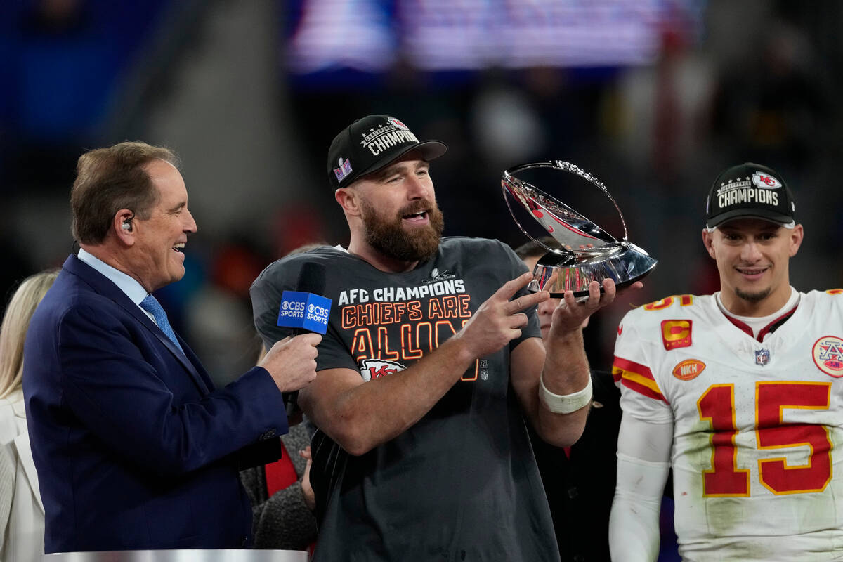 Kansas City Chiefs tight end Travis Kelce holds the Lamar Hunt trophy after an AFC Championship ...