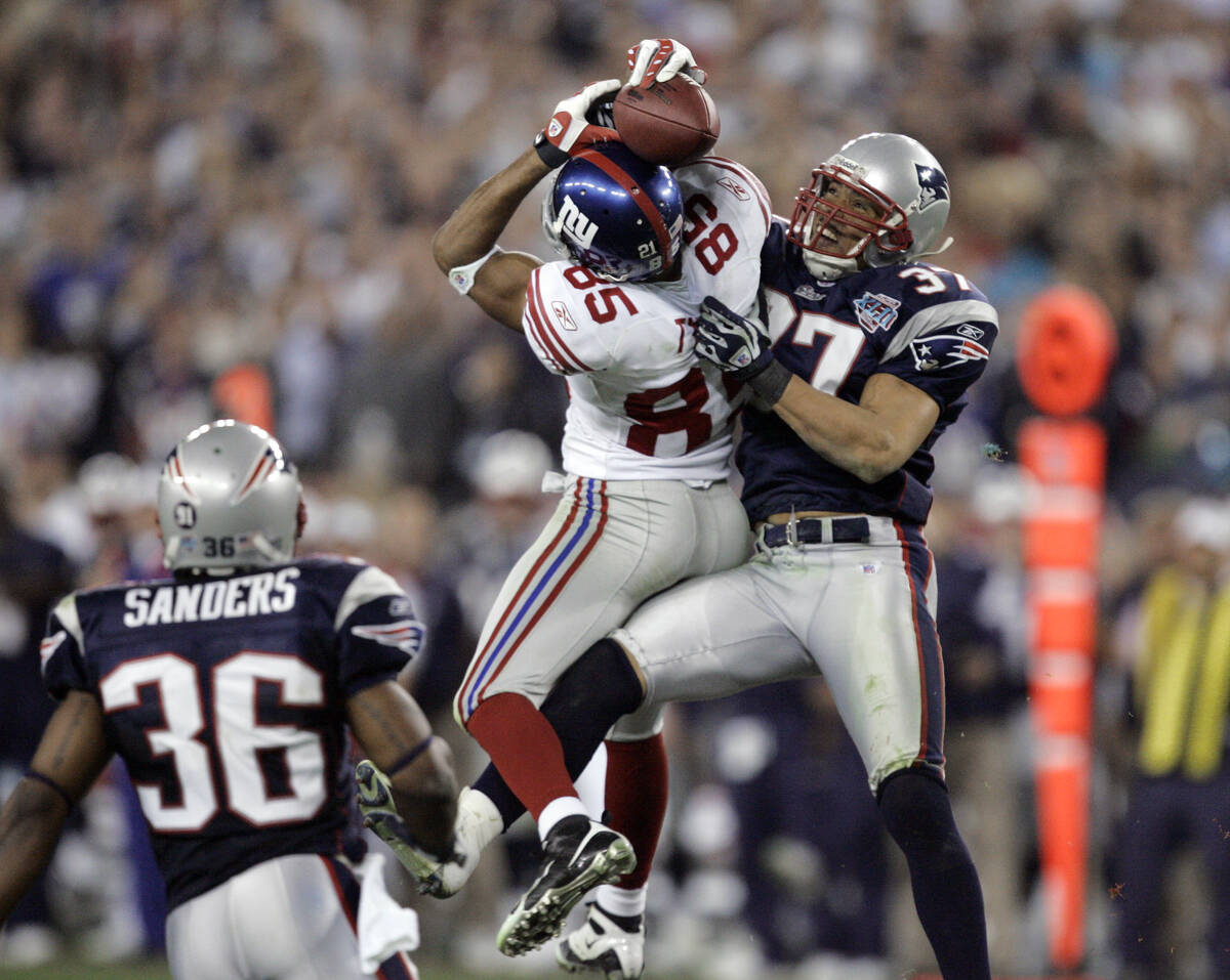 FILE - In this Feb. 3, 2008, file photo, New York Giants receiver David Tyree (85) catches a pa ...