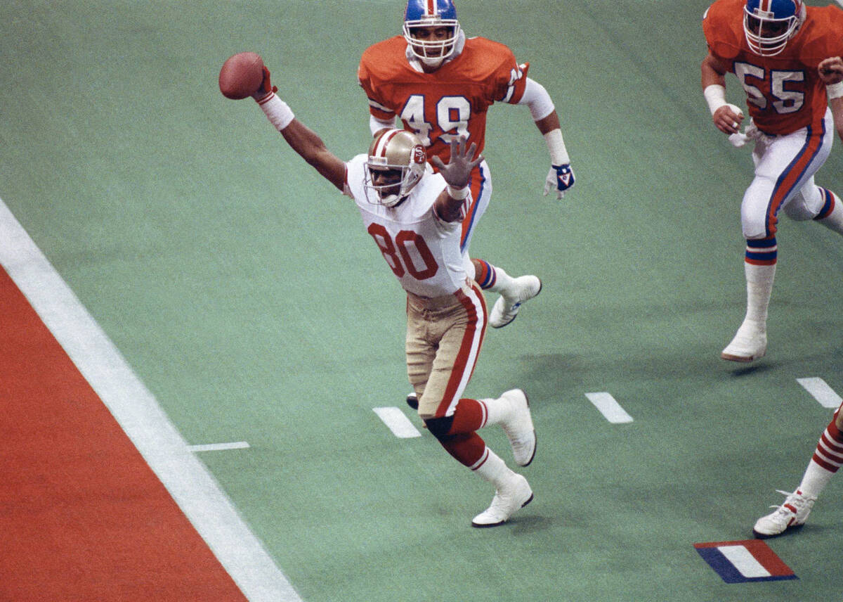 FILE - In this Jan. 28, 1990, file photo, San Francisco 49ers wide receiver Jerry Rice celebrat ...