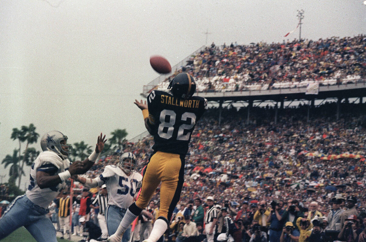 Pittsburgh Steelers wide receiver John Stallworth (82) goes high to haul in a pass from Terry B ...