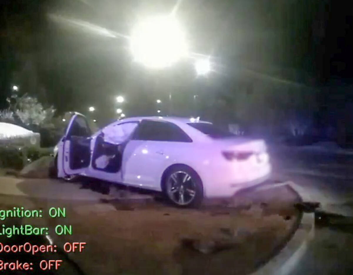 A screen grab of police body camera footage showing officer Katherine Cochran's white Audi, whi ...