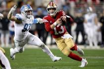 San Francisco 49ers quarterback Brock Purdy (13) runs during the NFC Championship NFL football ...