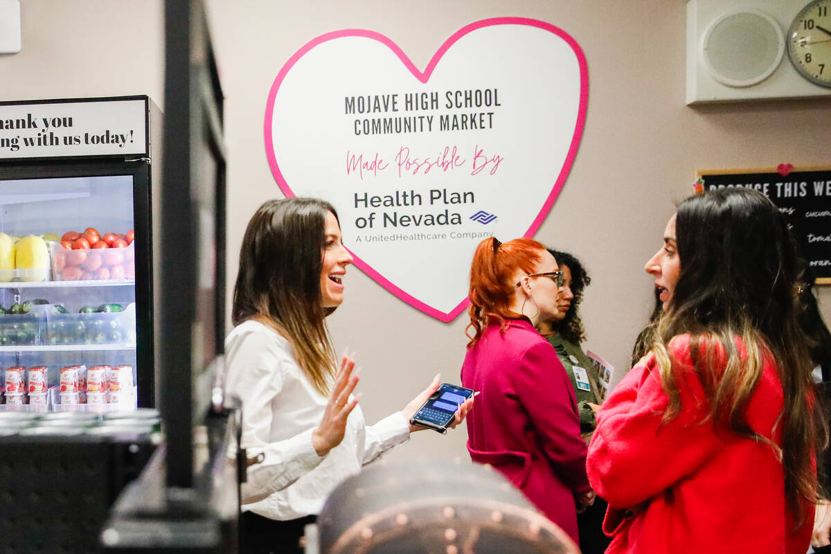 Brooke Neubauer, founder and CEO of the Just One Project, left, talks with Cynthia Lewis, speci ...