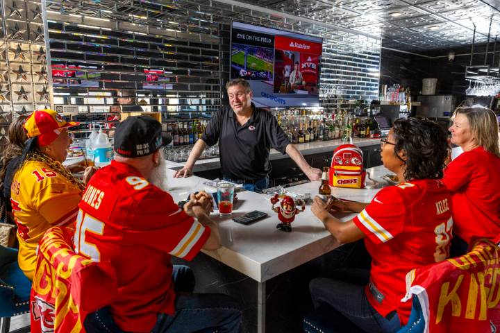 The Jackpot Bar owner Jeff Frederick, facing, chats with members of the KC CHIEFS - Las Vegas K ...