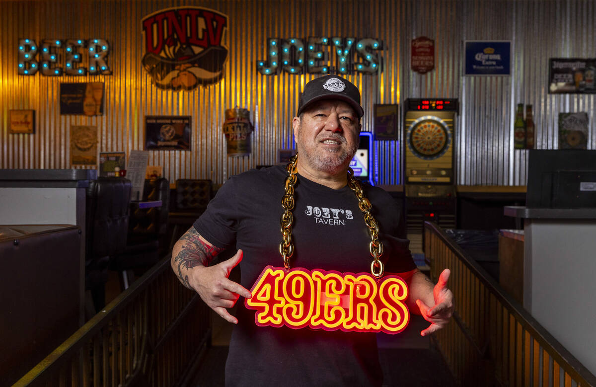 Owner Joey Johnson with a lighted 49ers sign as he and members of the North Vegas Faithfuls, a ...
