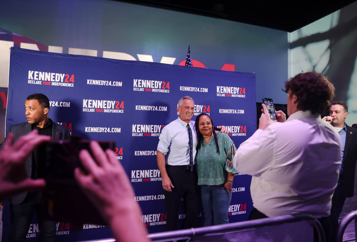 Independent presidential candidate Robert F. Kennedy takes a photo with a supporter during a ca ...
