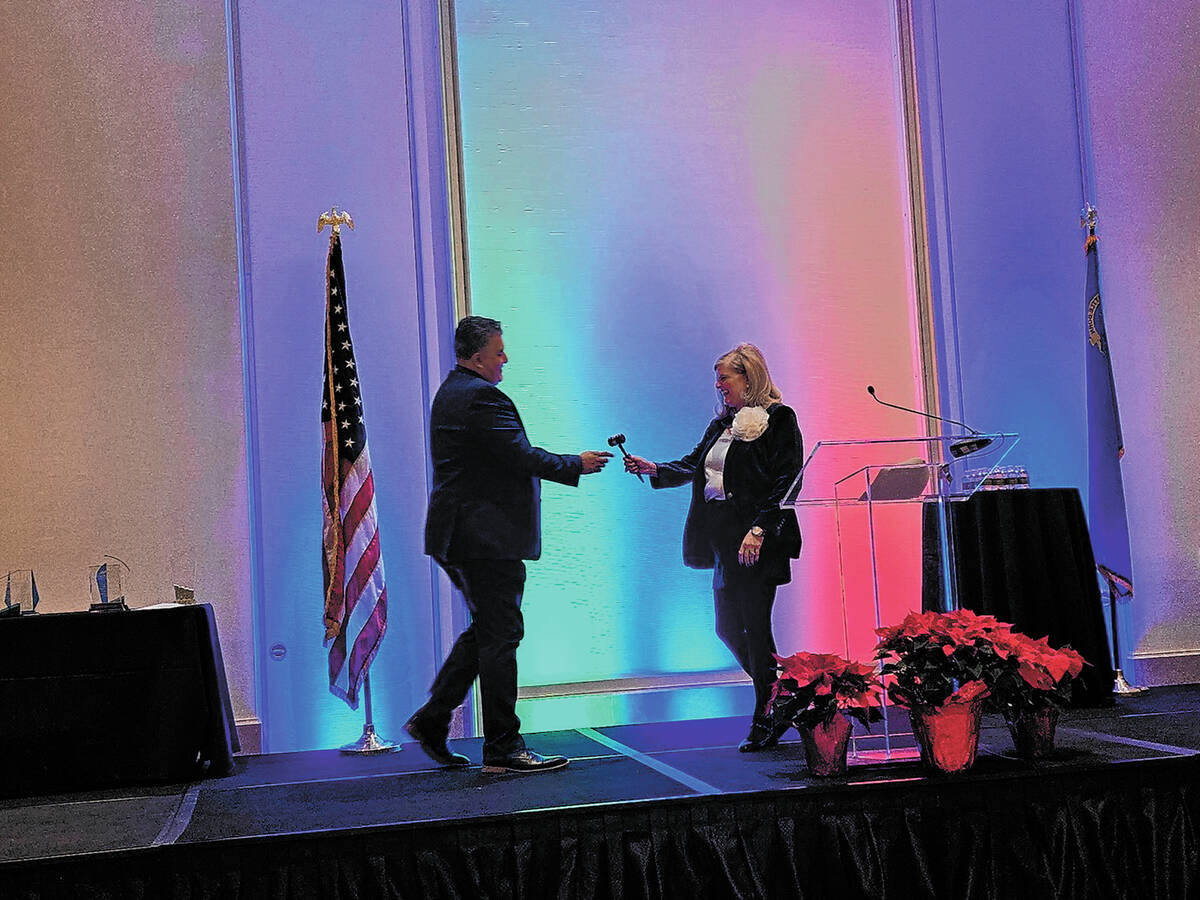 SNHBA 2024 SNHBA President Carlos Zuluaga accepted a ceremonial gavel from outgoing president N ...