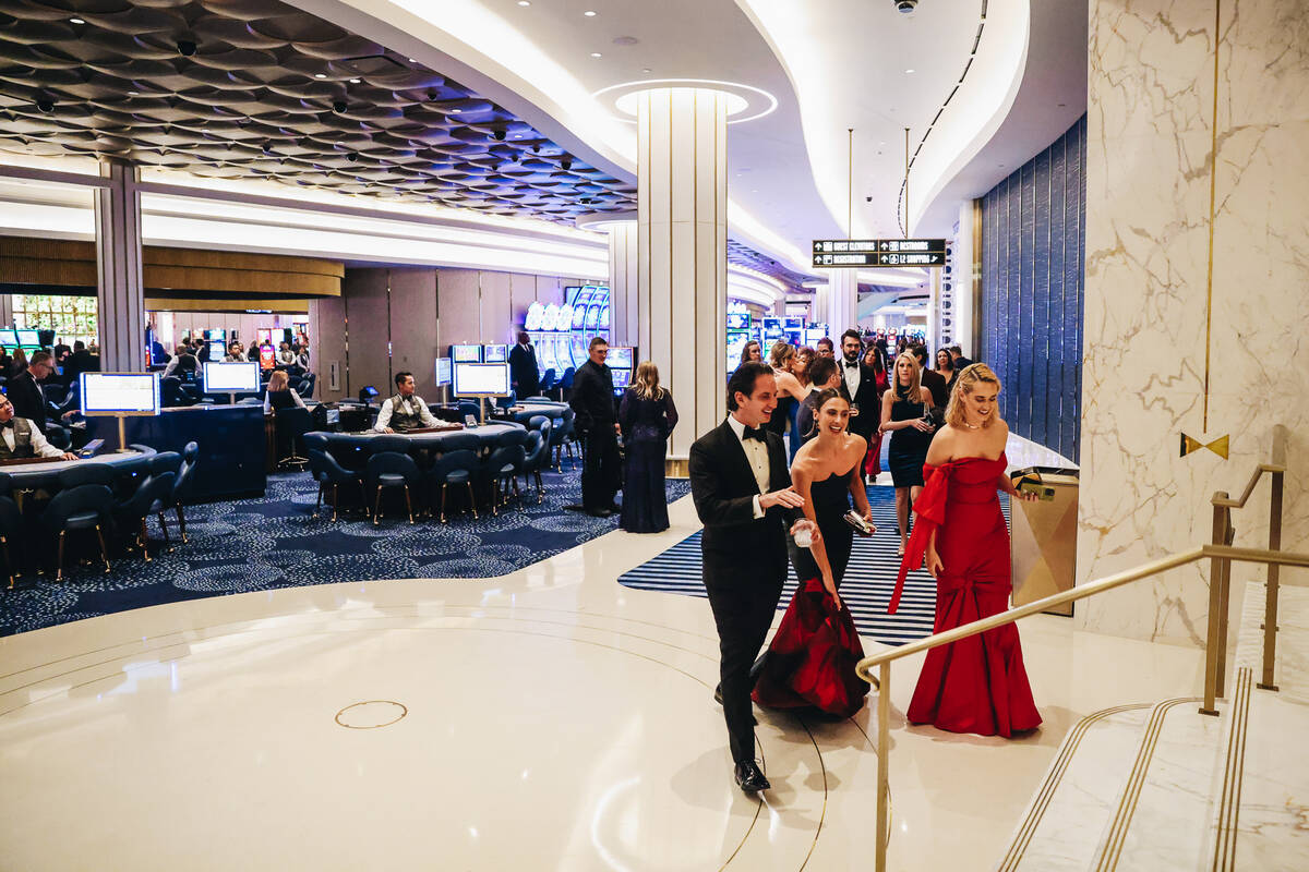 People enter the high limit room to watch the first dice roll at the Fontainebleau’s gra ...