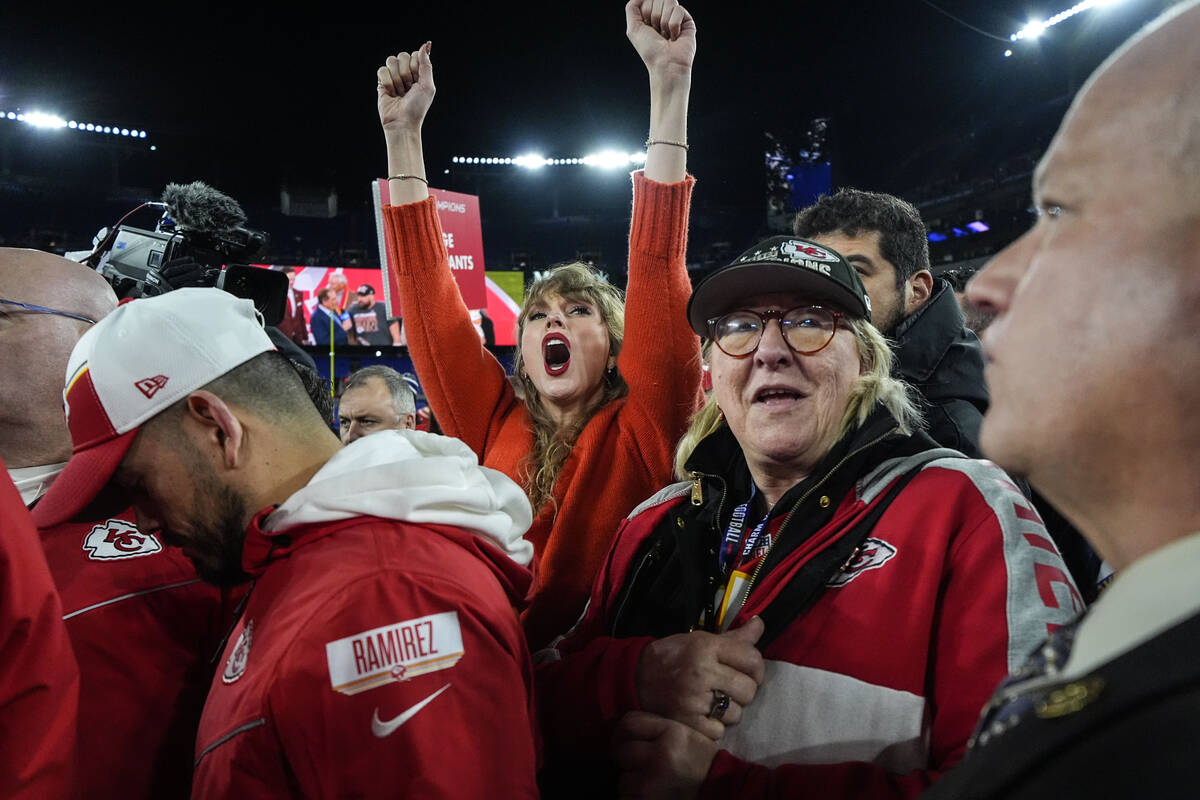 Taylor Swift, left, and Donna Kelce watch the Kansas City Chiefs receive the Lamar Hunt trophey ...