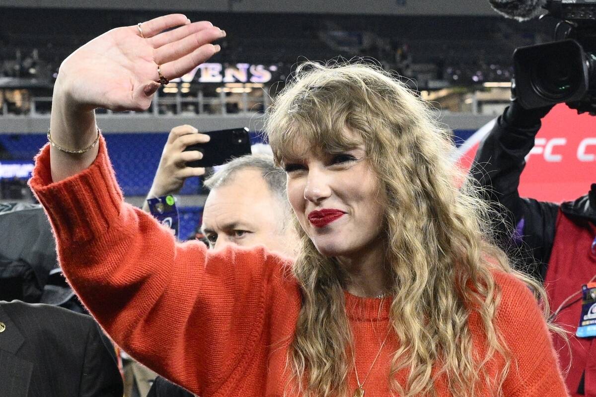 Taylor Swift waves after the AFC Championship NFL football game between the Baltimore Ravens an ...