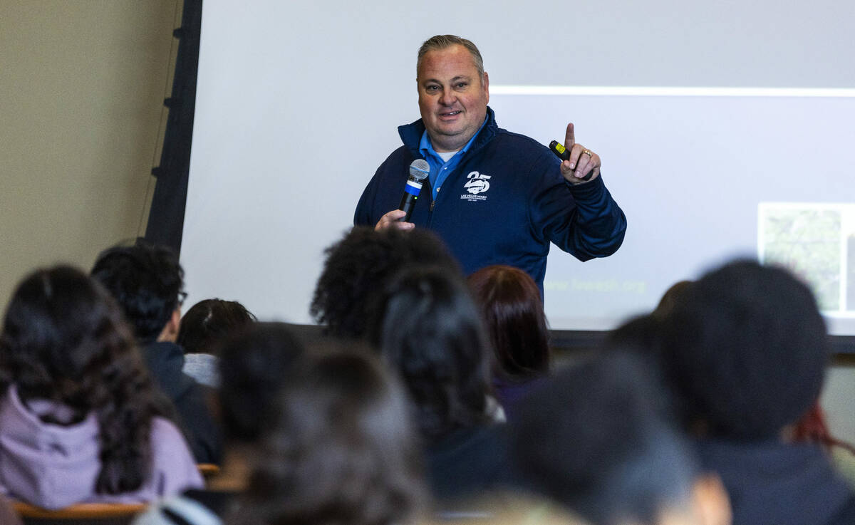 Environmental biologist Nick Rice with the Southern Nevada Water Authority talks with students ...