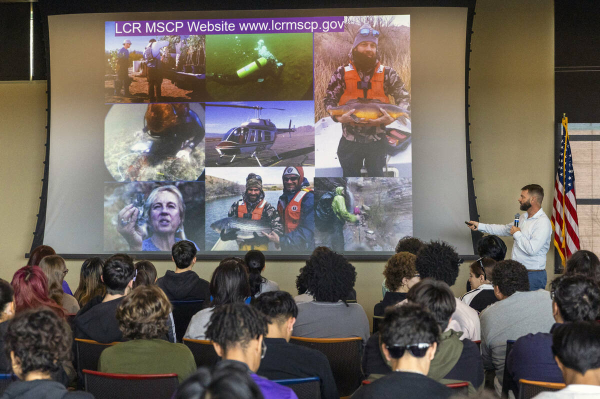 Biologist Nathan Lenon with the Bureau of Reclamation talks with students from Durango, Valley ...
