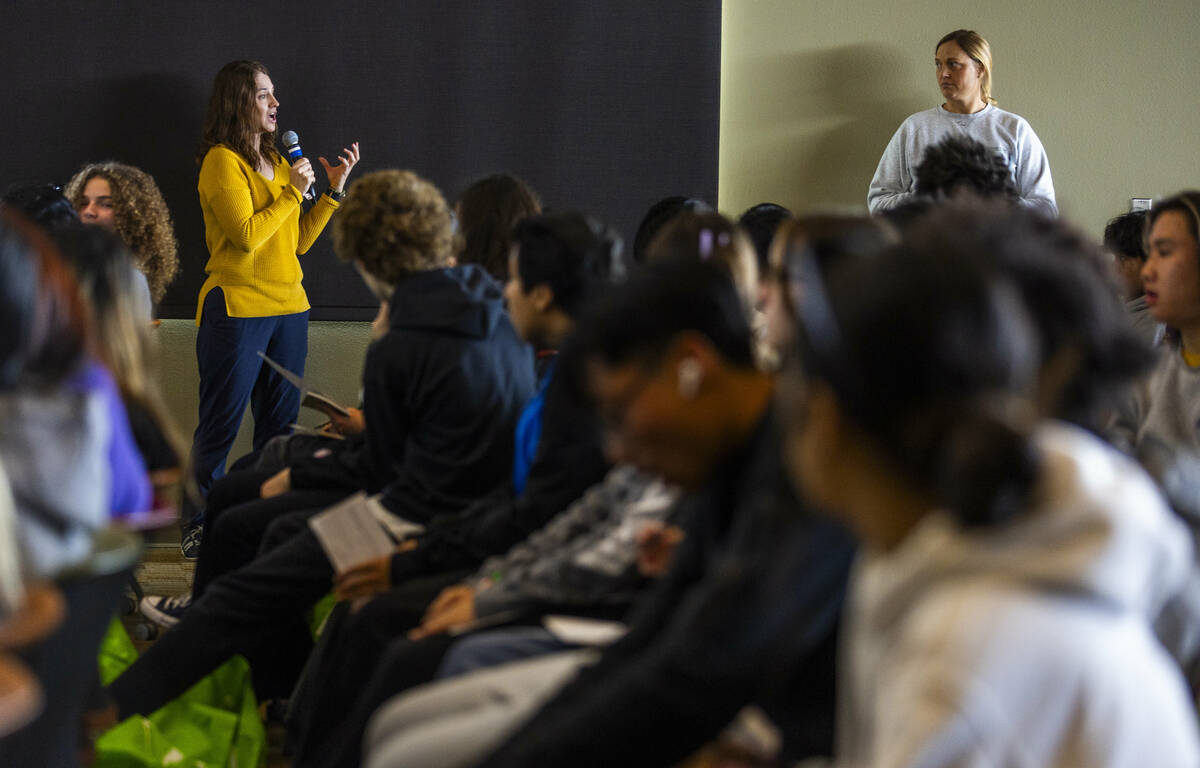 Nevada project manager Tanya Anderson, left, with the The Nature Conservancy talks with student ...