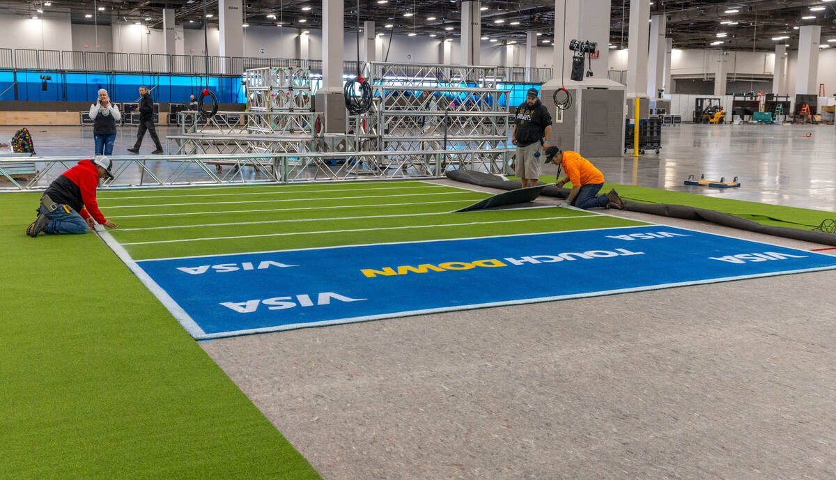 A small indoor field is installed as set up continues for the Super Bowl Experience at the Mand ...