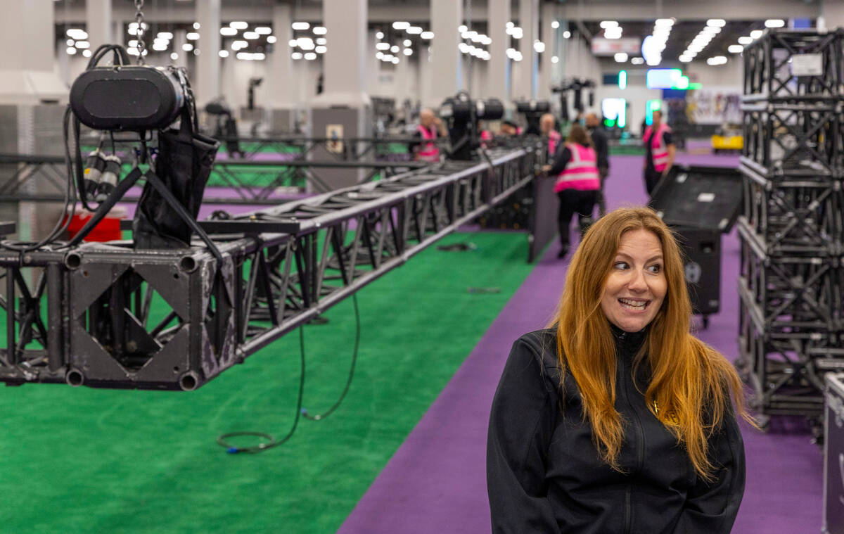 Nicki Ewell, Senior Director of Events for the National Football League, speaks at the set up...