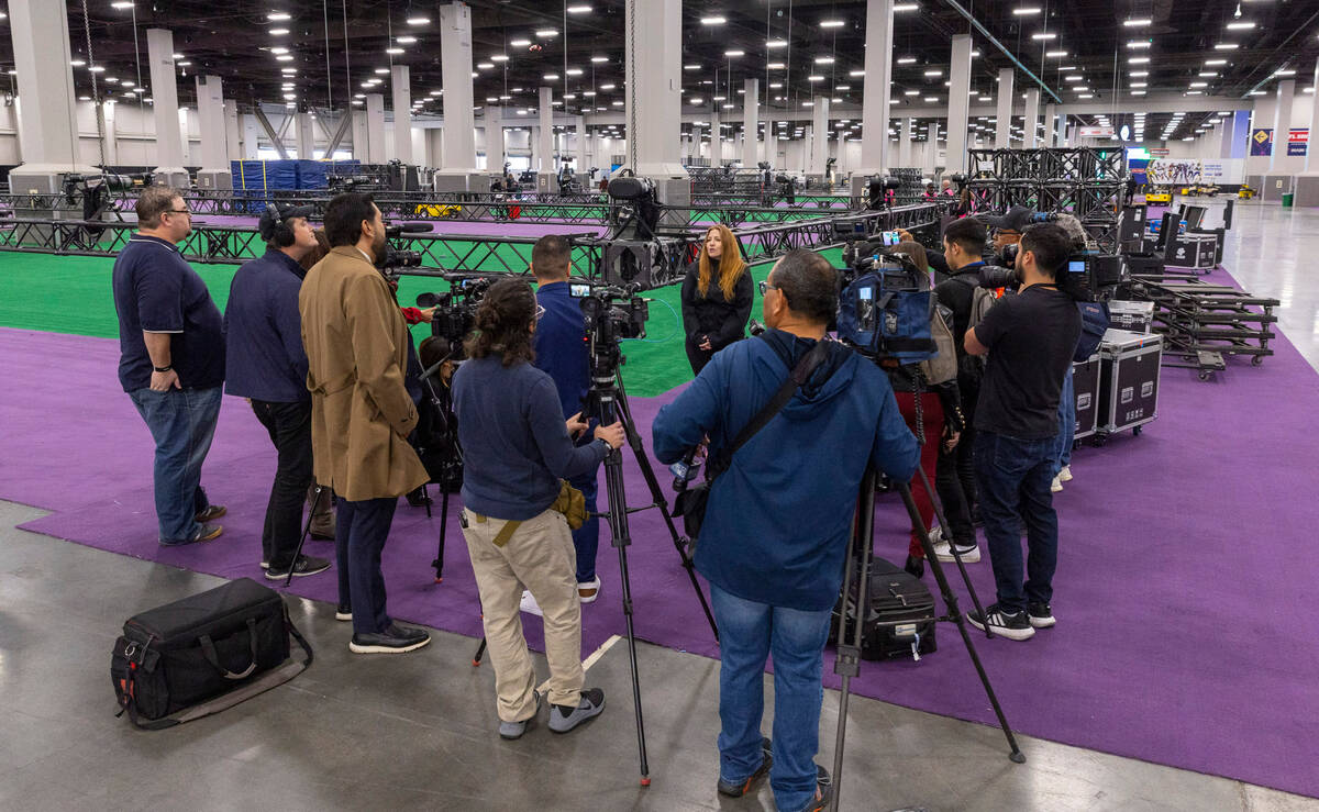 Nicki Ewell, Senior Director of Events for the National Football League, speaks at the set up...